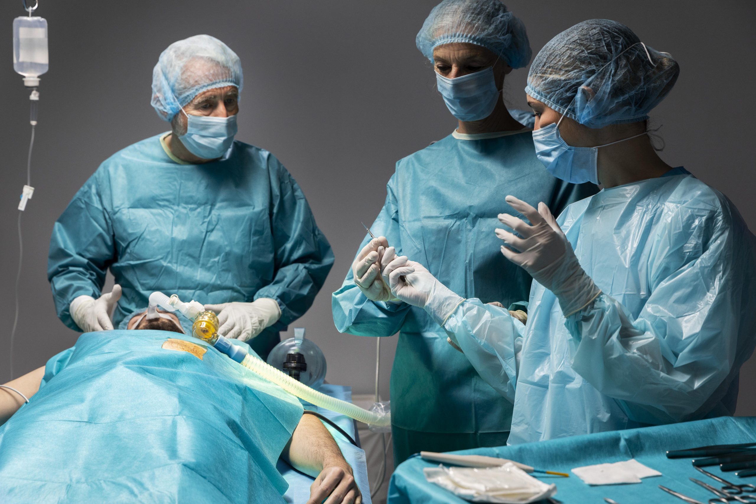 Doctors doing surgical procedure patient